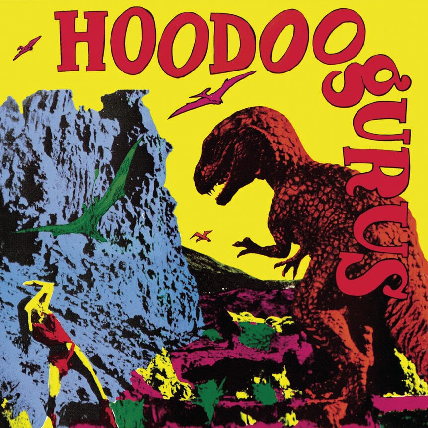 An album cover featuring a red T-rex attacking green and red pterodactyls in front of a mountain.