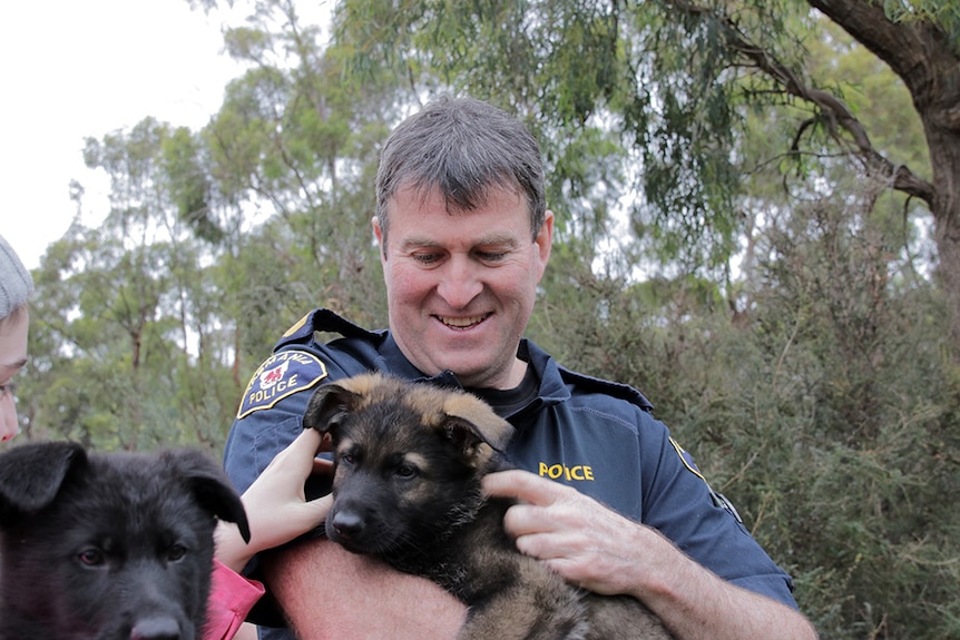 Iain Shepherd with police dog pup