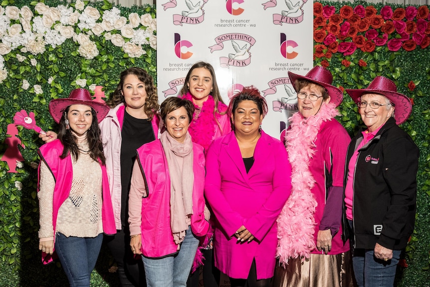 A group of women dressed in pink for a breast cancer fundraiser.   