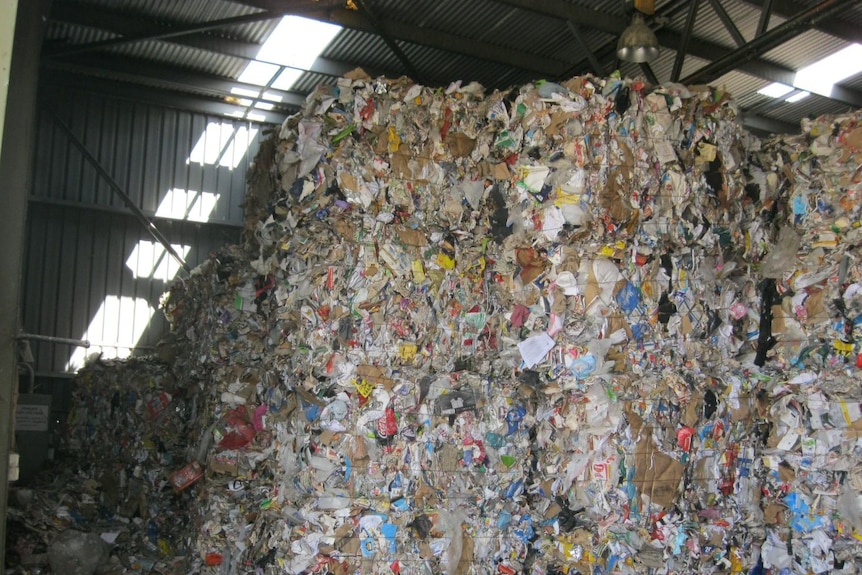 Compacted rubbish stored in a shed.