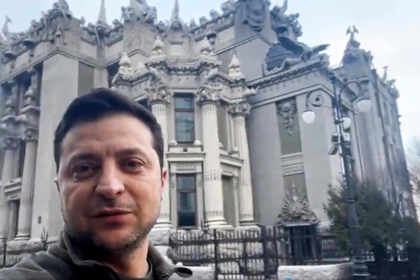 Ukrainian President Volodymyr Zelenskyy speaks to the nation via his phone in the center of Kyiv, Ukraine.