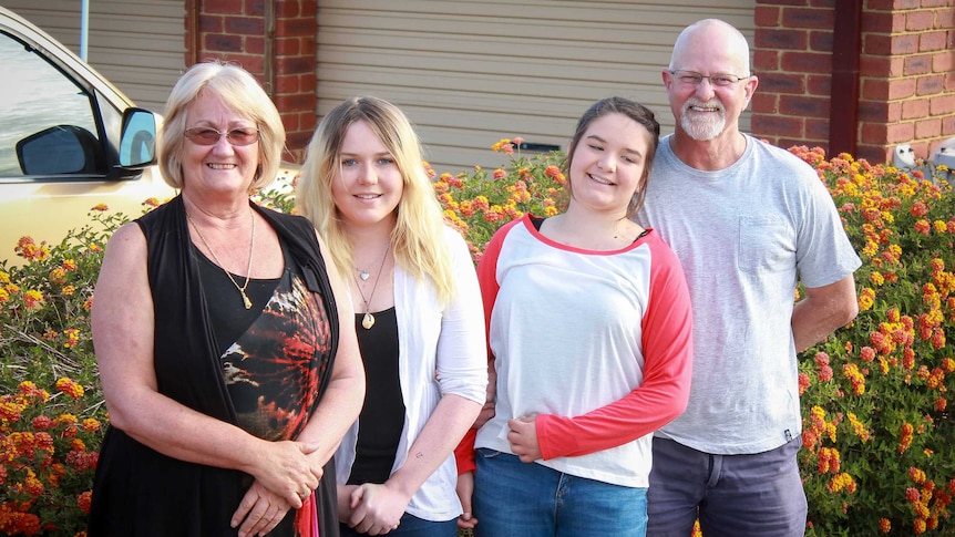 Roxy Martin, her husband John and her two grandchildren, Paige and Tea.