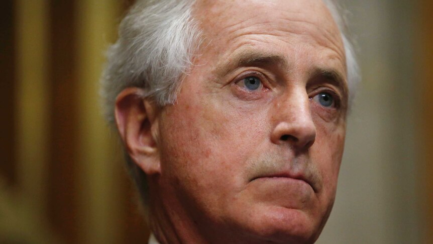 A close-up of Bob Corker's face as he listens during a Senate hearing.