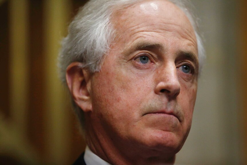 A close-up of Bob Corker's face as he listens during a Senate hearing.