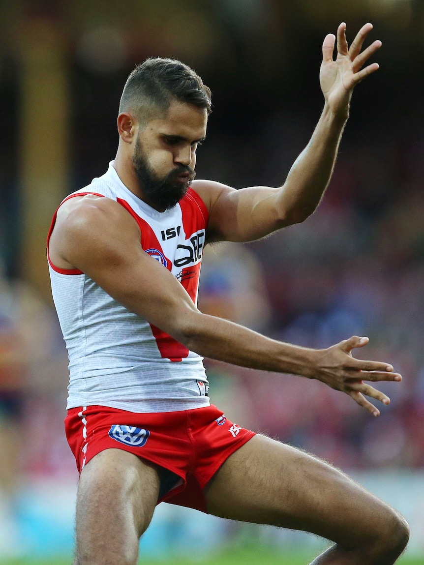 Lewis Jetta dances after kicking goal