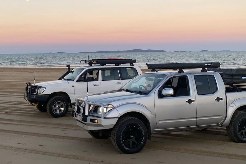 4WD vehicles on a beach.