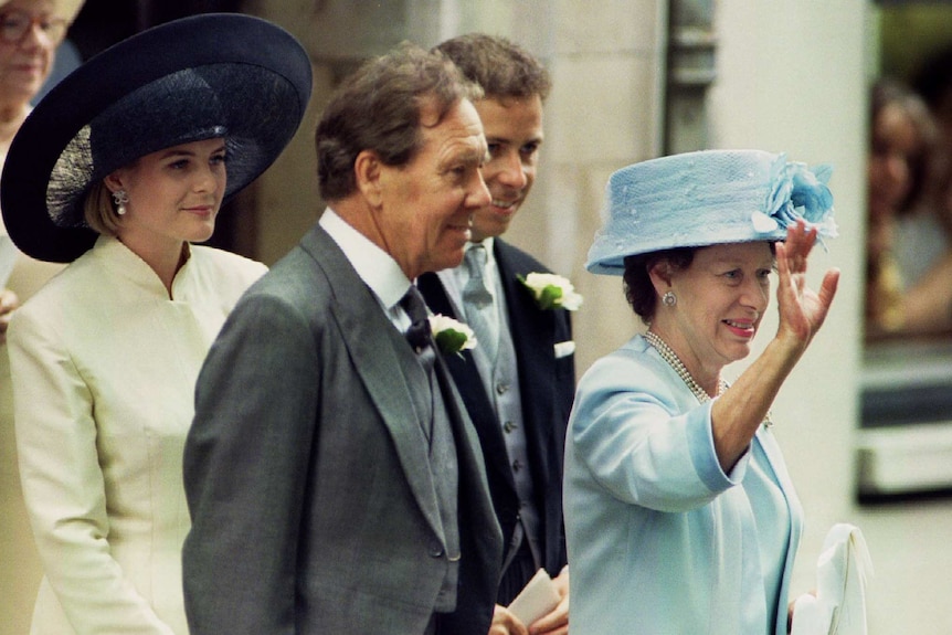 Princess Margaret is flanked by her former husband Lord Snowdon leaving church.