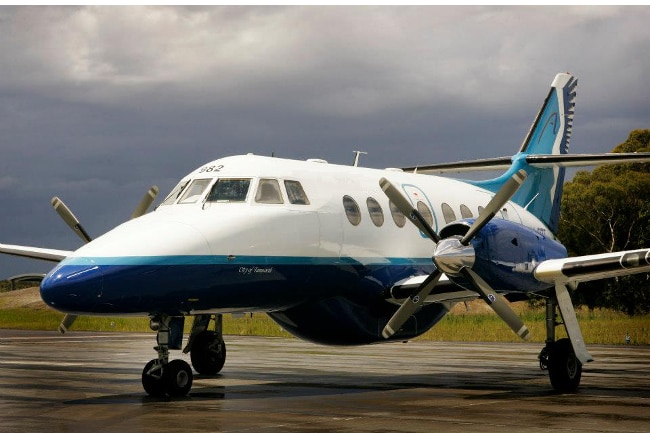 A Jetstream 32 (turboprop) aircraft parked on a tarmac.