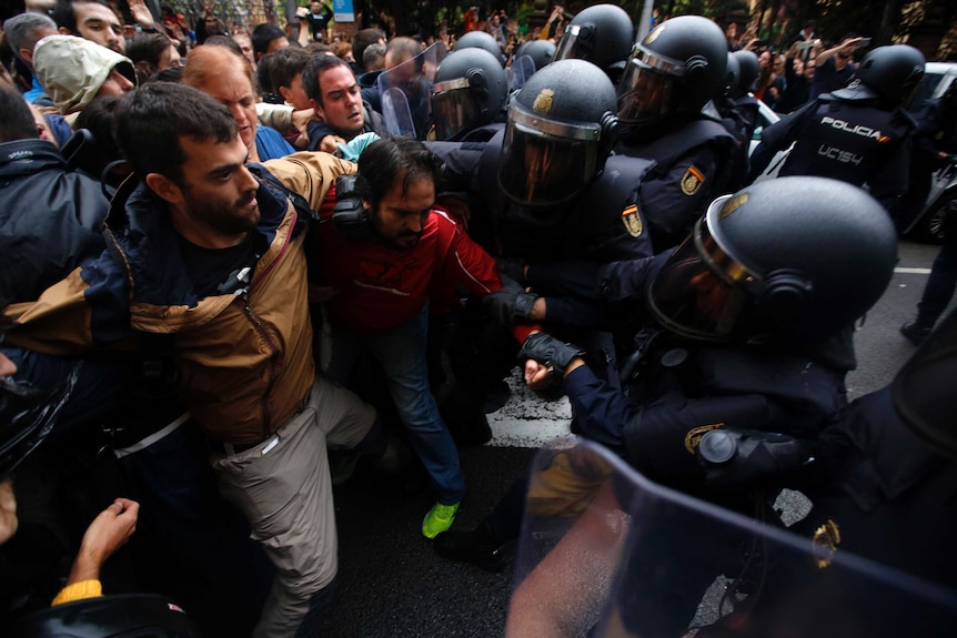 Pro-referendum supporters clash with Spanish National Police