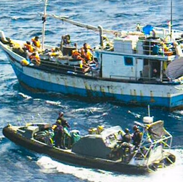 An image supplied by Border Force of the Australian navy approaching an asylum seeker boat.