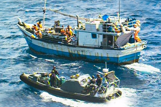 An image supplied by Border Force of the Australian navy approaching an asylum seeker boat.