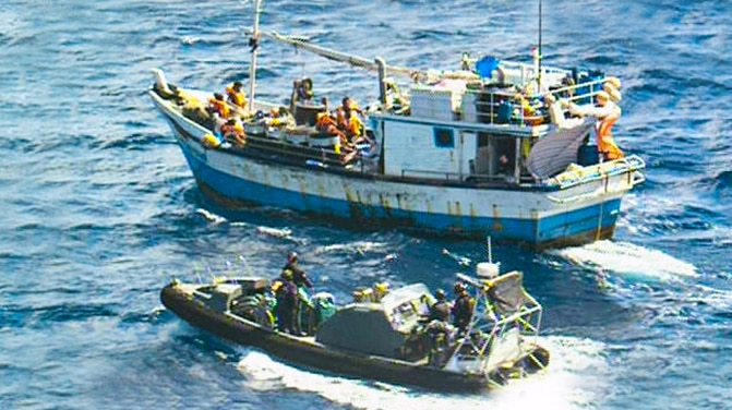 An image supplied by Border Force of the Australian navy approaching an asylum seeker boat.