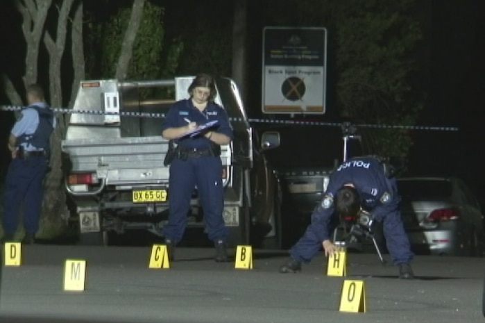 Police examine crime scene at Yagoona