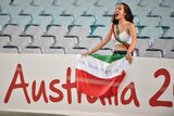 A fan of Iran cheers during their game against Qatar in the AFC Asian Cup