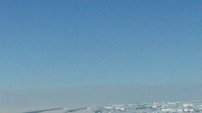 A chunk of ice breaks away from the Antarctic ice shelf