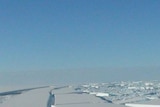 A chunk of ice breaks away from the Antarctic ice shelf