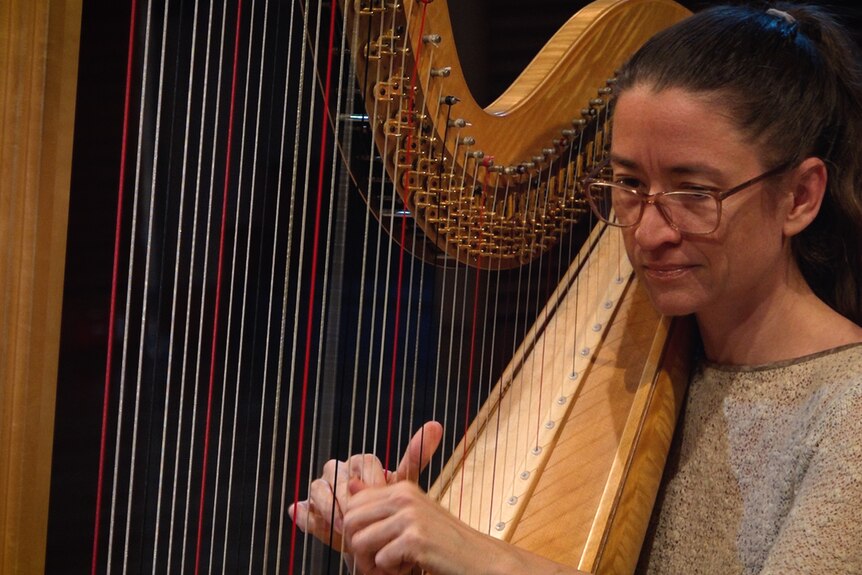 Genevieve Lang plays harp in the ABC studio.