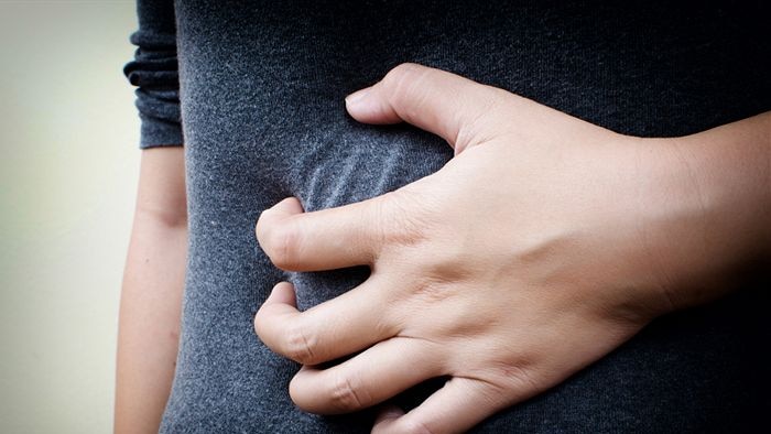 A person holding their stomach