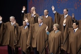 Kevin Rudd joins other world leaders in his APEC poncho