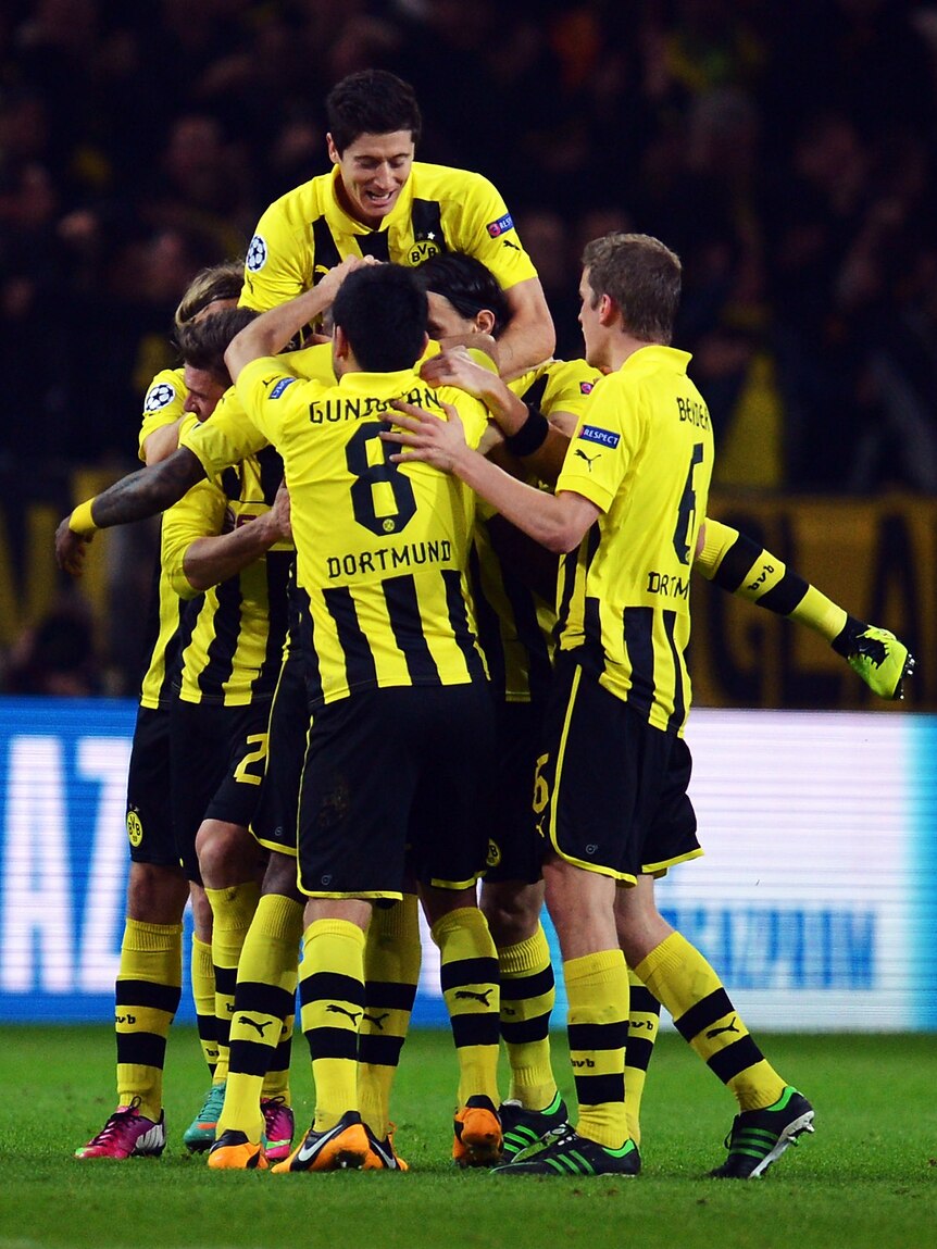 Dortmund players celebrate Felipe Santana's opener against Shakhtar.