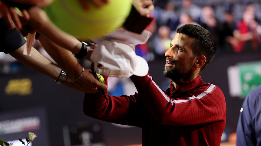 Djokovic struck on the head by water bottle while signing autographs at Italian Open