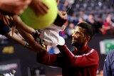 Novak Djokovic signs autographs at Italian Open.