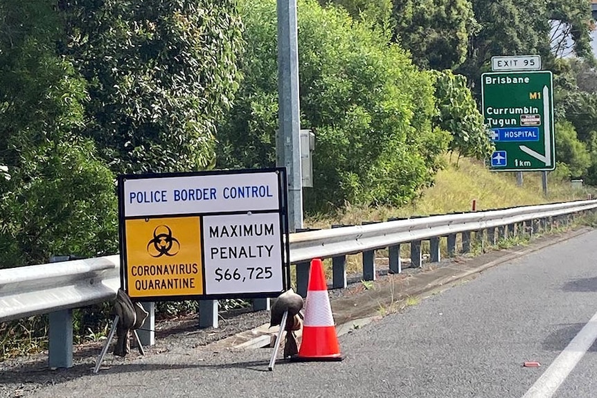 Police border control road sign on highway leading into Queensland's Gold Coast.