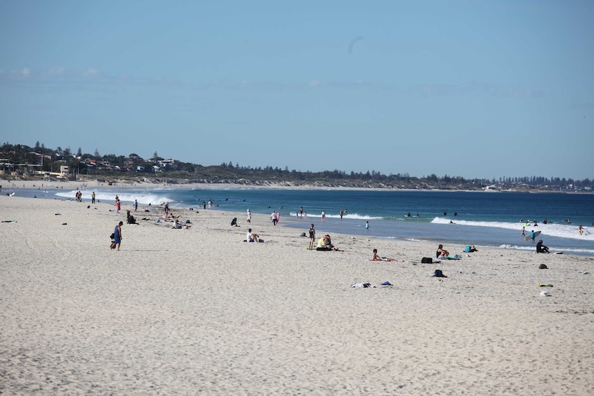 People sitting on beach alone or in pairs