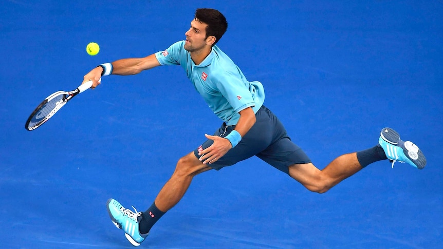 Novak Djokovic hits a running forehand against Fernando Verdasco