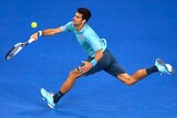Novak Djokovic hits a running forehand against Fernando Verdasco
