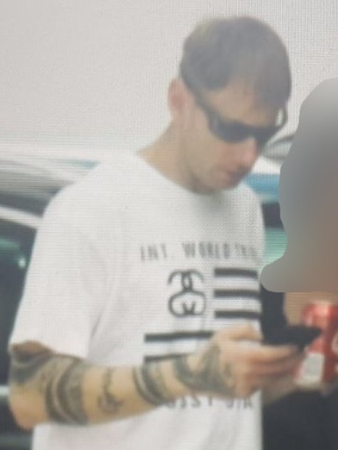 Man states at phone in blury photo