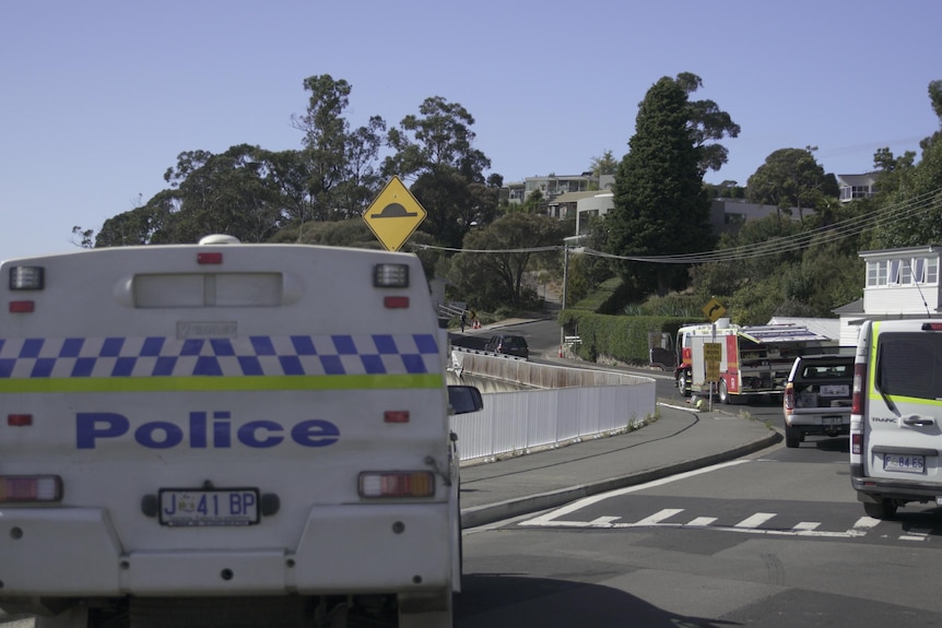 Police car, fire truck and ambulance parked on a sunny street 