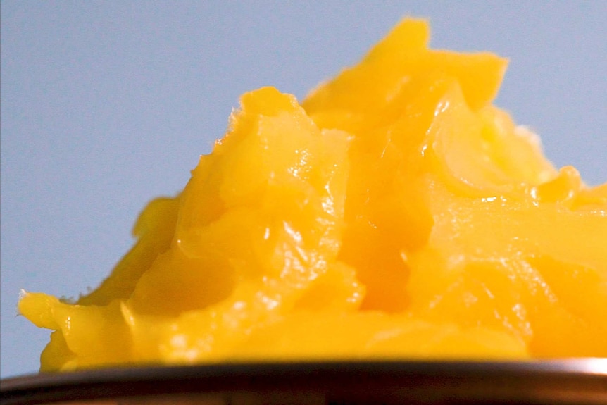 A close up photograph of a mound of ghee