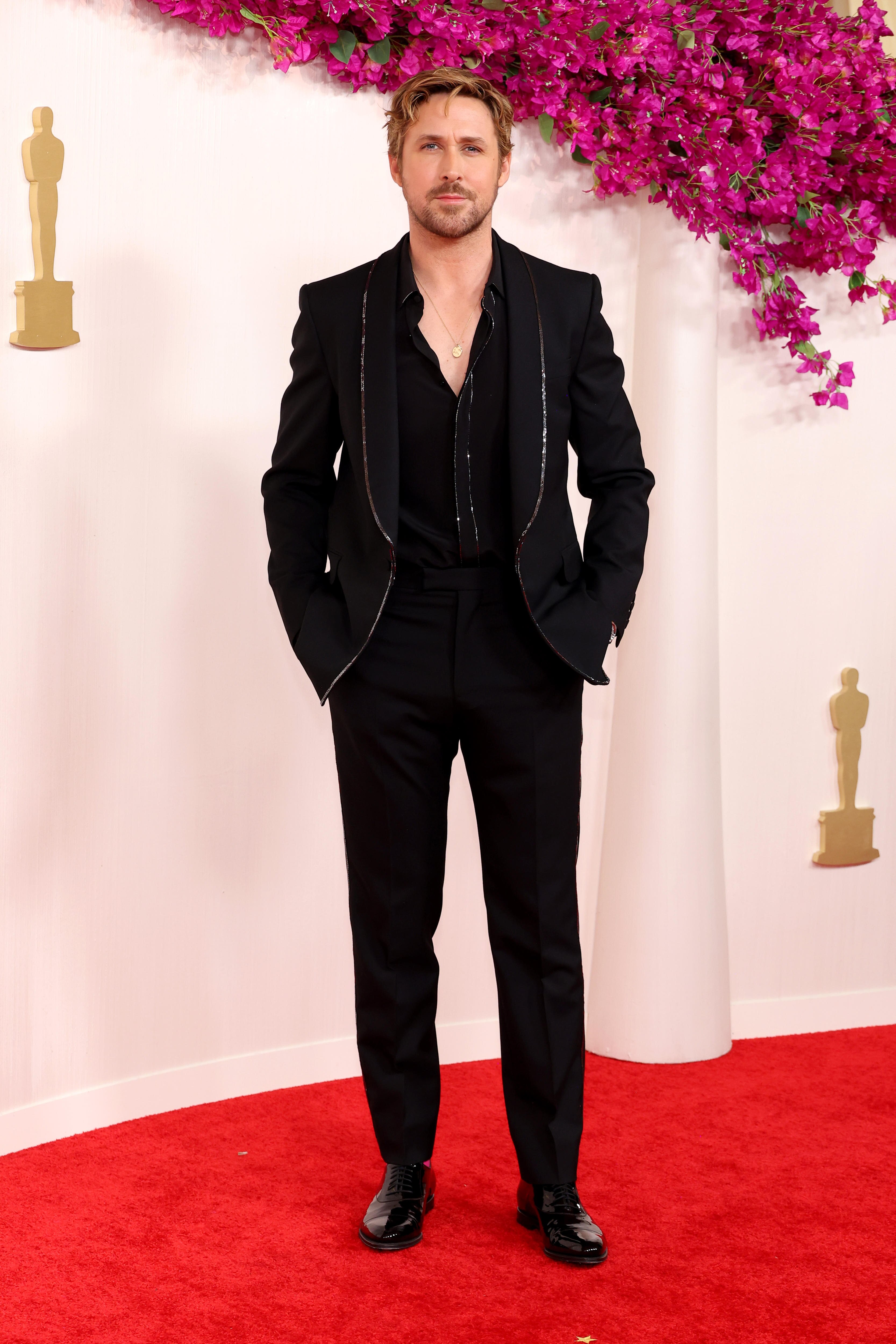 Ryan Gosling in a black suit on the Oscars red carpet