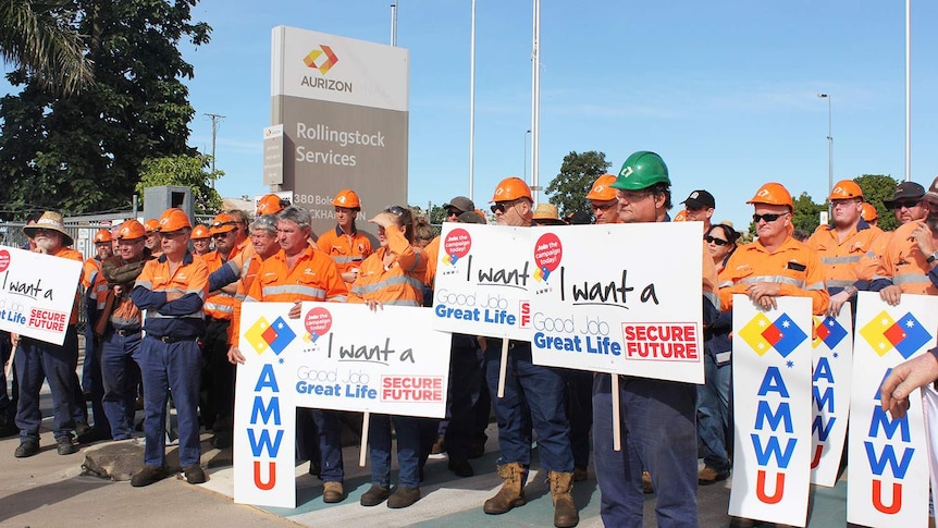 Workers protest job losses outside the Aurizon Rollingstock Services facility in Rockhampton