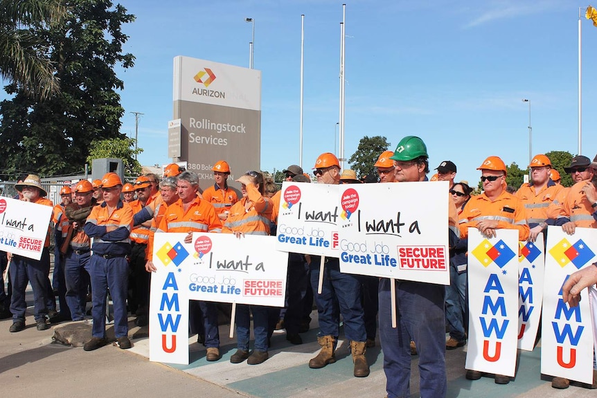 Workers protest job losses outside the Aurizon Rollingstock Services facility in Rockhampton