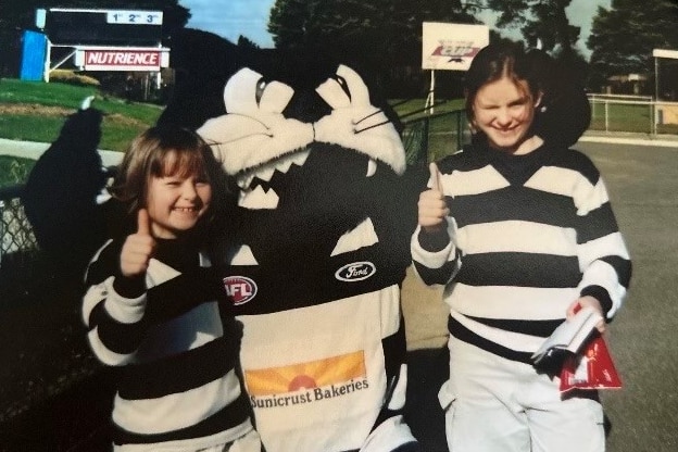 Kate Surman meets the Geelong mascot as a kid at Kardinia Park