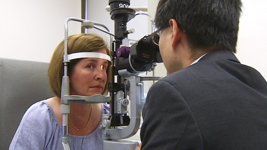 Associate Professor Fred Chen checks Carolyn Miocevich's eyes at the Lions Eye Institute in Perth