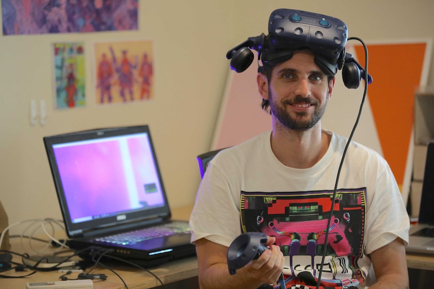 White man wearing virtual reality headgear