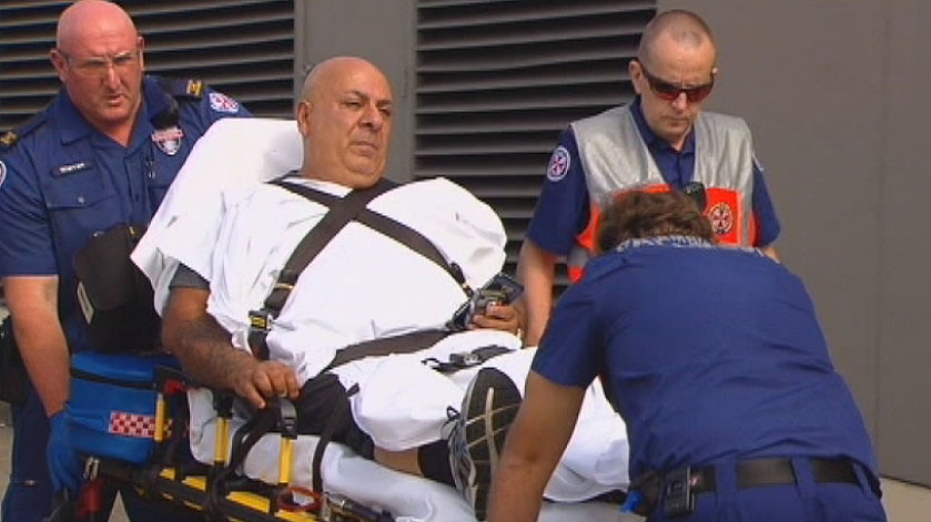 Injured man taken away from scene of Bankstown shooting