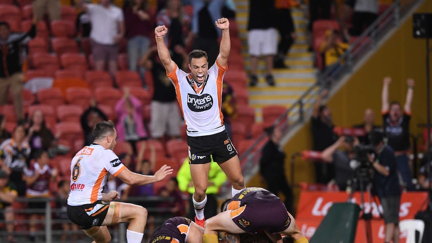 Michael Chee Kam of the Tigers scores the winning try during the Round 5 NRL match.