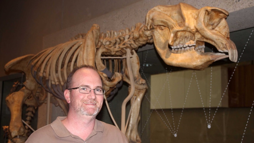 Queensland Museum’s Senior Curator, Doctor Scott Hocknull with one of the dinosaurs from the Museums pre-historic collection.