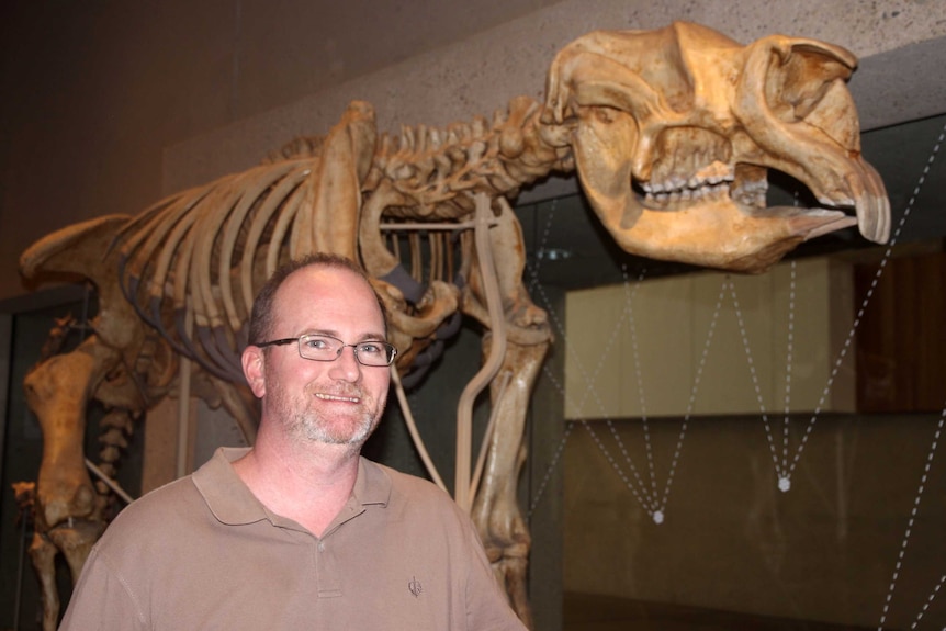 Queensland Museum’s Senior Curator, Doctor Scott Hocknull with one of the dinosaurs from the Museums pre-historic collection.