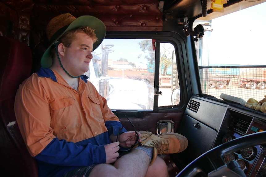 William Anthony sits in his father's truck.