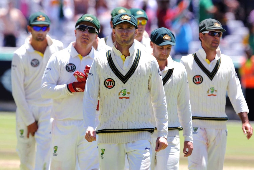 Michael Clarke leads his players off the field in Cape Town. (Gallo Images via Getty Images: Lee Warren)