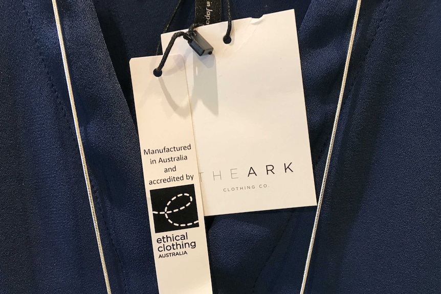 The Ark Clothing Company's label alongside an Ethical Clothing Australia tag.