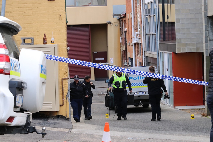 Tasmanian police in a Hobart laneway after a shooting
