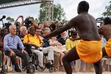 Prime minister Malcolm Turnbull, Galarrwuy Yunupingu and Opposition Leader Bill Shorten watch traditional aboriginal dancers.