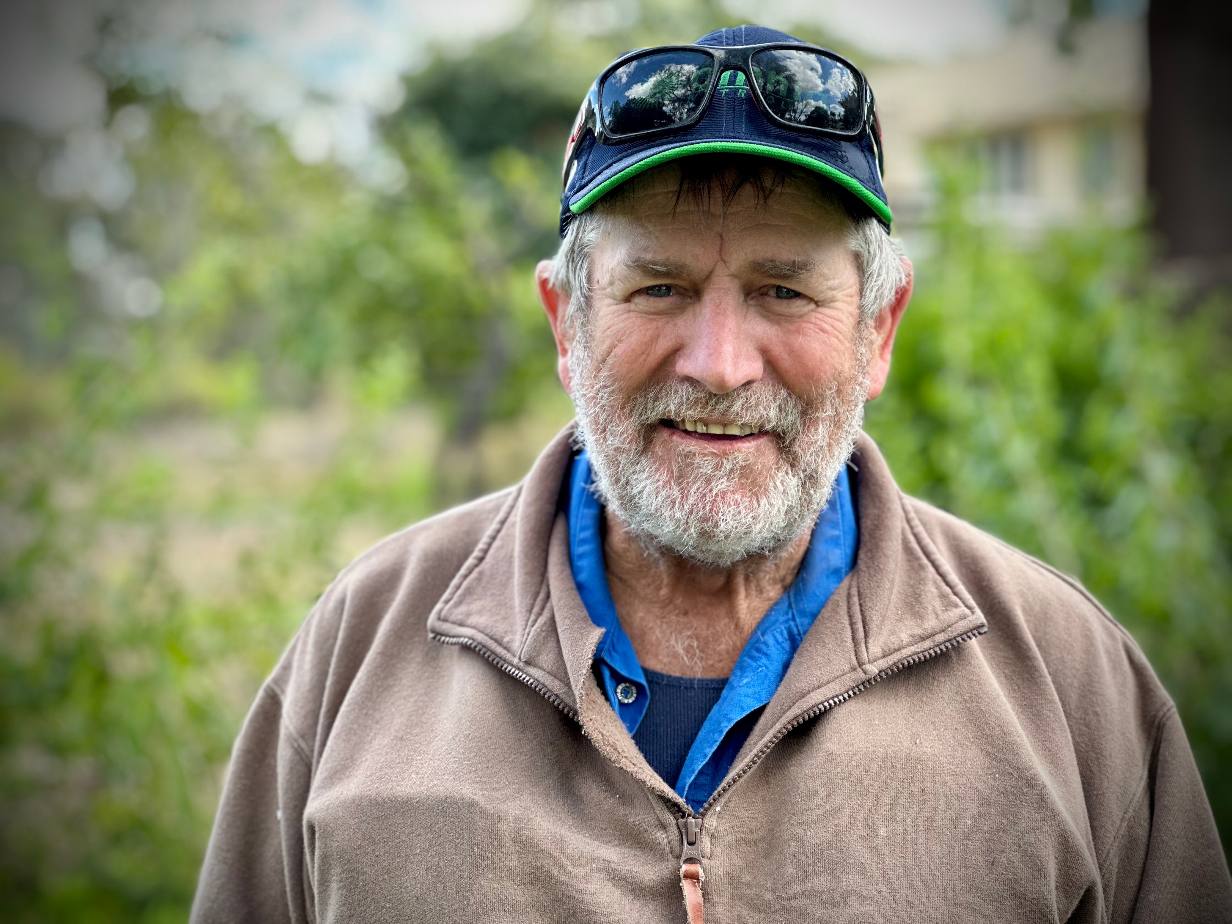 A man smiles at the camera