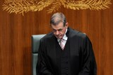 Speaker Peter Slipper wears the robe of office as he arrives for Question Time